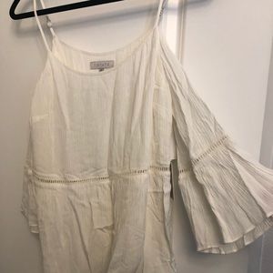 1state cutout top with flowy sleeves.